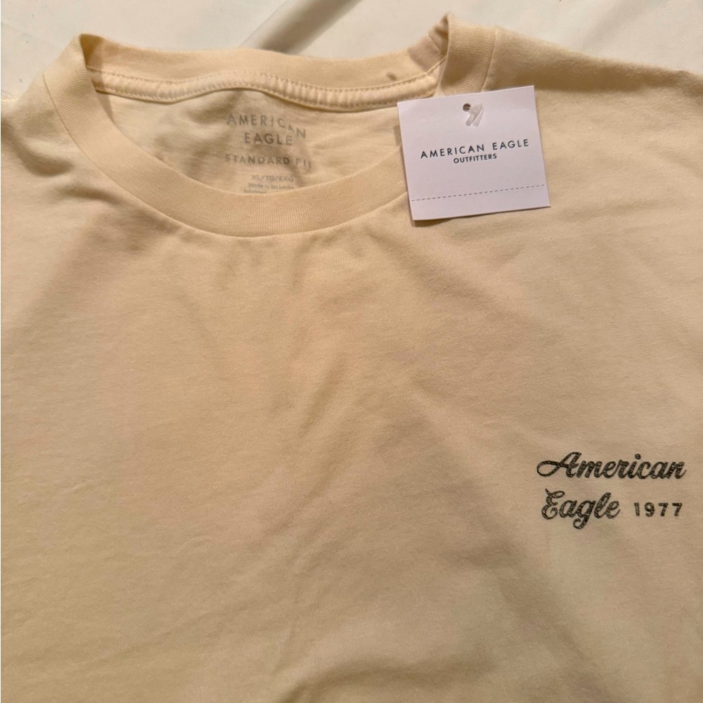 American Eagle 🦅 men’s xl light tan logo shirt. NWT!